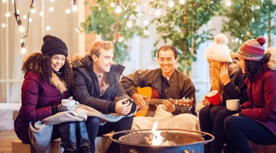 Singing around a fire pit